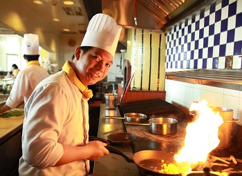 chef in a restaurant kitchen cooking